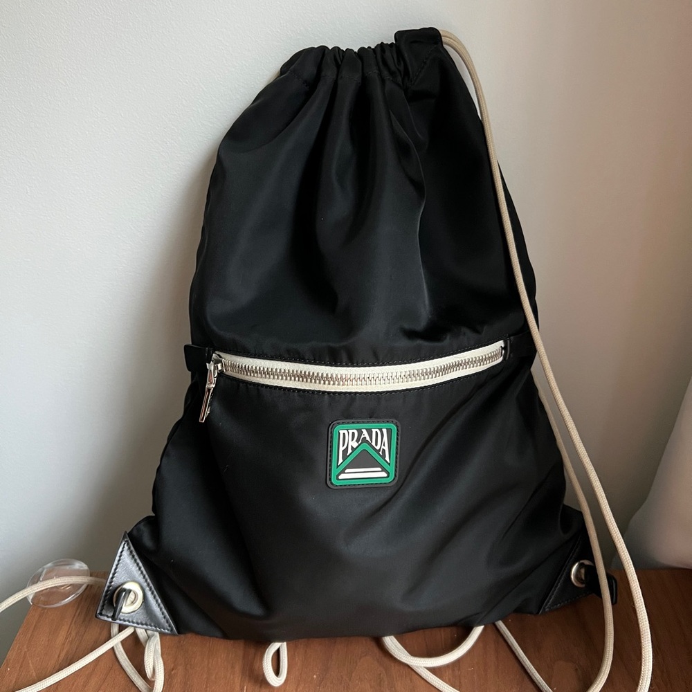 Prada Black Nylon Drawstring Backpack with White Trim and Green Logo